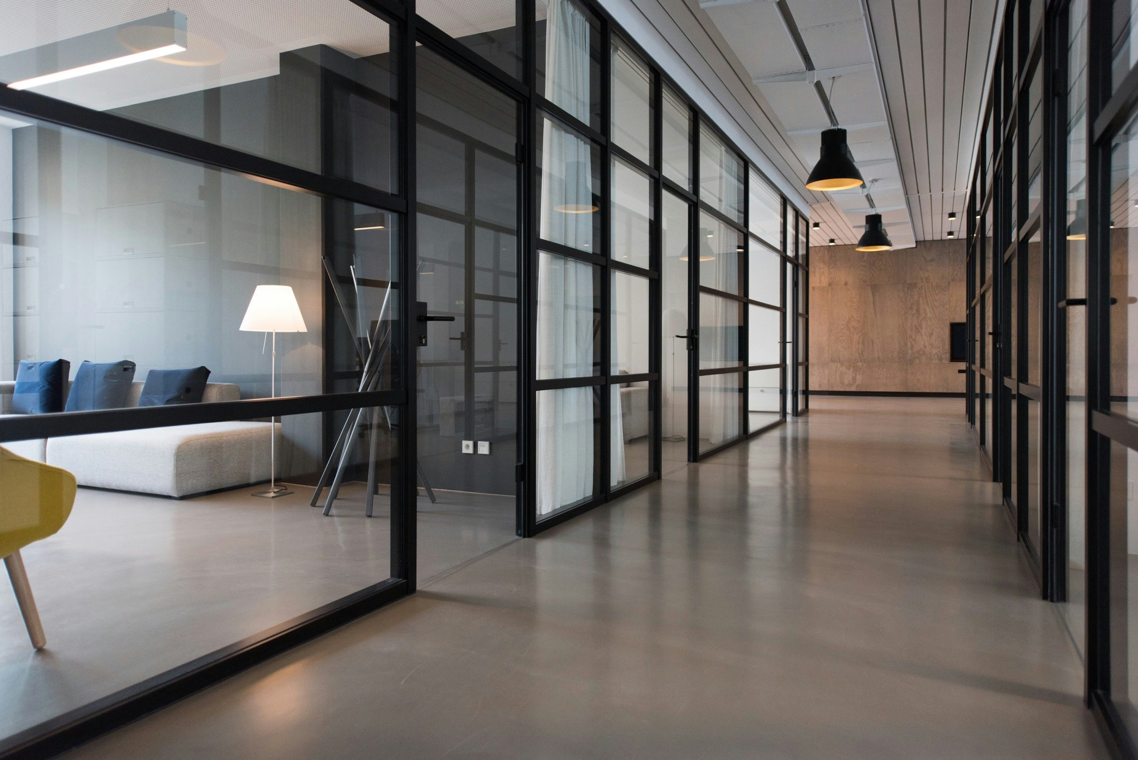 Offices with a clean modern look with glass walls and doors.